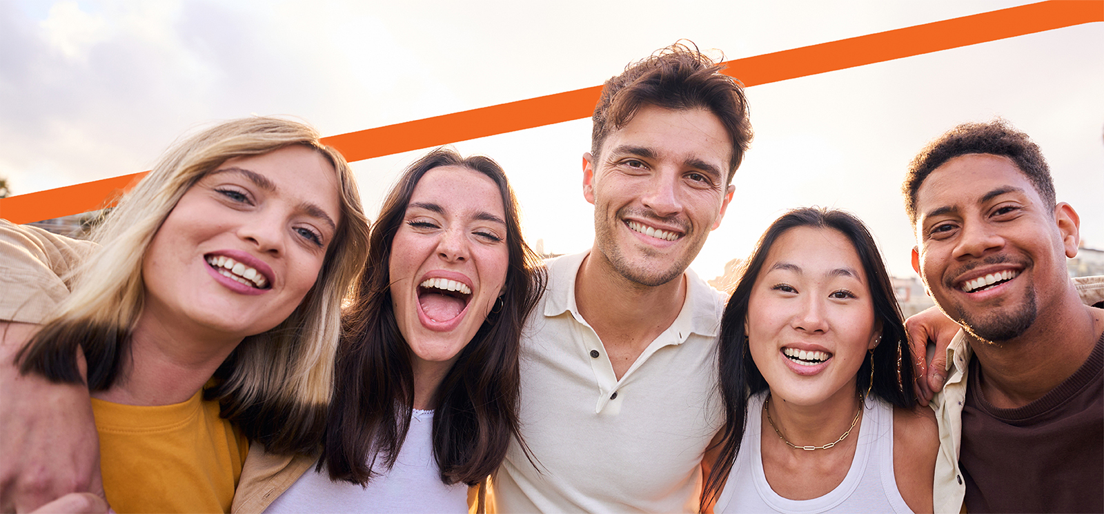 Group of five friends smiling.