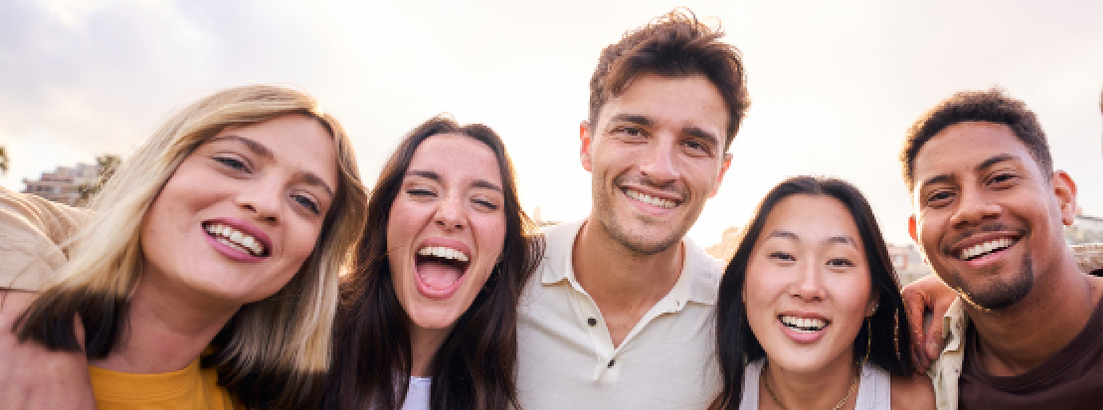 Group of five smiling friends.