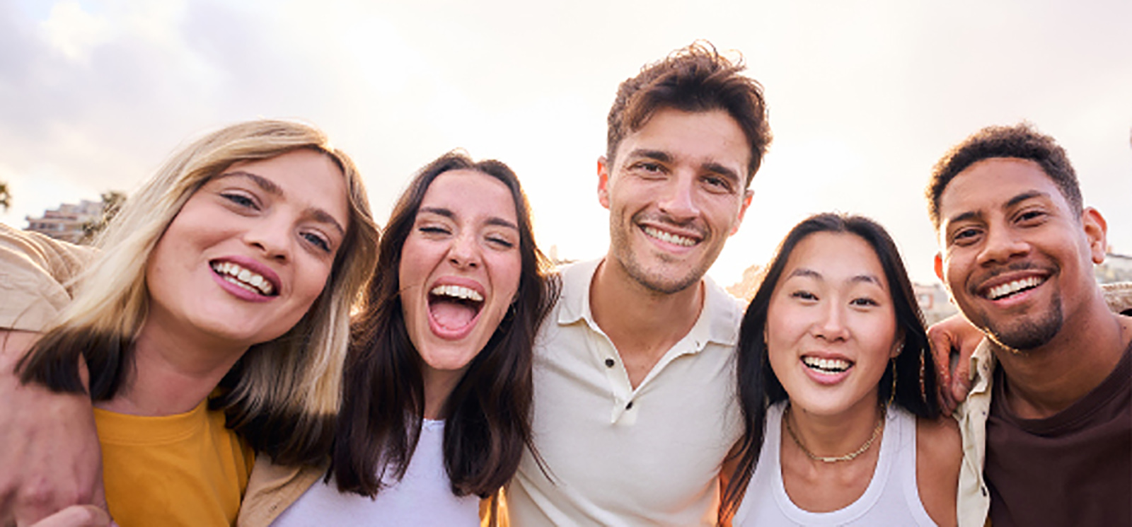 Group of five smiling friends.